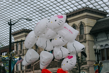 Osaka, Japan - April 12, 2016: Unidentified Balloon seller in Hello Kitty Costume selling Balloons. April 12, 2016 in Universal Studio Japan.のeditorial素材