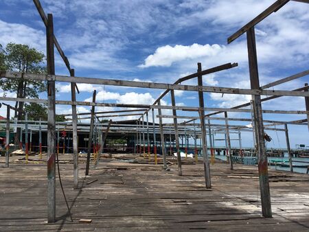 old abandoned store during demolition with blue skyの写真素材