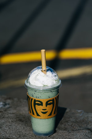 Jeju Island, South Korea - July 10, 2022: Jeju Mugwort rice cake Frappuccino with wripcream.のeditorial素材