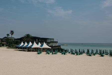 Jeju Island, South Korea - July 10, 2022: The lined parasols on Hamdeok Beach, Jeju Island.のeditorial素材