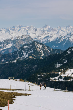 Rigi, Switzerland - April 12, 2022: People walking to the view point at Rigi Kulm with alps mountain in background.のeditorial素材
