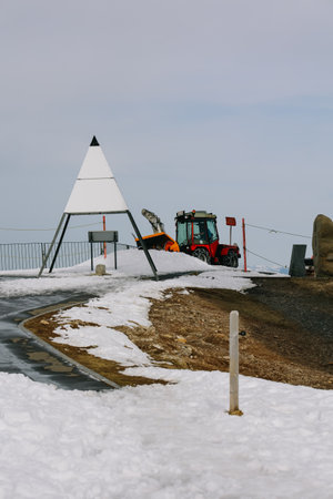Switzerland - April 12, 2022: Snow truck is clearing walkway at Rigi, Switzerland.