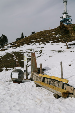Wooden bench on snow at Rigi Kulm, Switzerland.の写真素材