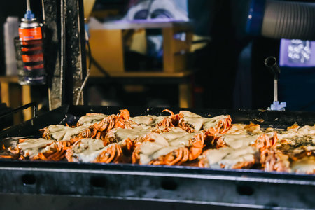 Grilled lobter with cheese at Dongmun Market in Jeju Island, South Korea. This market is one of Jeju famous tourist spot.の写真素材