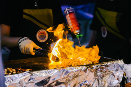 Jeju Island, South Korea - July 11, 2022: Korean street food at Dongmun night market, the famous street food area were crowd with many tourist from around the world.のeditorial素材