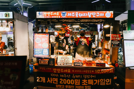Jeju Island, South Korea - July 11, 2022: Korean street food at Dongmun night market, the famous street food area were crowd with many tourist from around the world.のeditorial素材