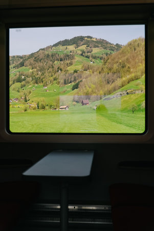 Wonderful view of Switzerland in spring from the window of train. Soft and blur focus.