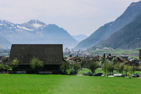 Scenic mountain village surrounded by the mountain, Canton Schwyz, Switzerland, Europe.の写真素材