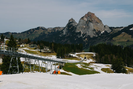 Tracks of steepest funicular at mountain village Stoos on a sunny spring day arriving at mountain station.の写真素材