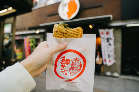 Sendai, Japan - April 8, 2023: Japanese taiyaki, fish-shaped cake with sweet red bean paste of Taikichi shop in Sendai.のeditorial素材