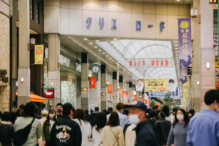 Miyagi, Japan - April 8, 2023: Pedestrians walk through a shopping street name Clis Road with lot of...