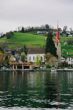 Luzern, Switzerland - April 12, 2022: Waterview on Swiss village, house or castle near Lucerne, Switzerland.のeditorial素材