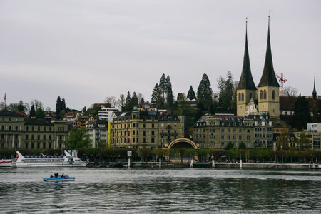 Luzern, Switzerland - April 12, 2022: View of Church of St. Leodegar or Hofkirche St. Leodegar Lucerne lakefront, this is a Roman Catholic church in the city of Lucerne, Switzerland.のeditorial素材