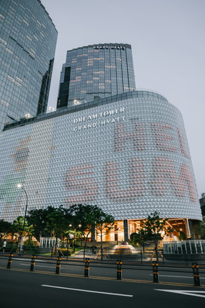 Jeju Island, South Korea - July 12, 2022: Modern building in Jeju city in the evening.のeditorial素材