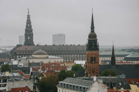 Beautiful view of Copenhagen city from top on round tower in rainy day.