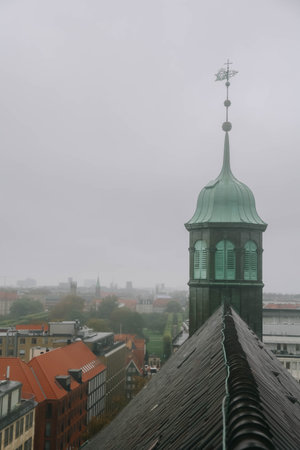 View of Trinitatis Kirke from the Round Tower in Copenhagen city, Denmark on rainy day.の写真素材