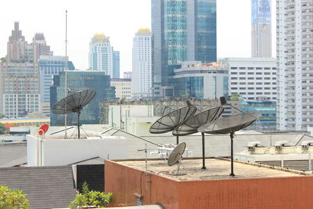 Satellite dish on the top of building の写真素材