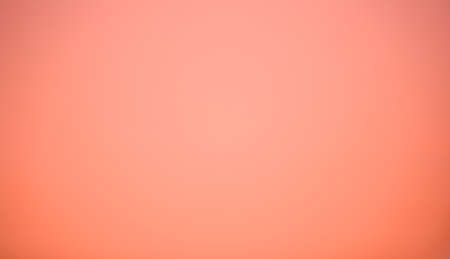 The background picture of peach color in a soft tone. There is a smooth and clean surface with low contrast. Feeling calm, cold, relax, and comfortable. The idea for simply wallpaper with copy space.の写真素材