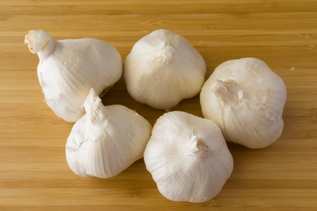 Garlic on wood backgroundの写真素材