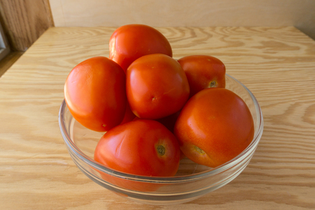 Tomato on wood backgroundの写真素材