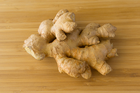 Ginger on wood backgroundの写真素材