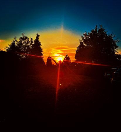 Silhouette of a man on a background of the setting sunの写真素材