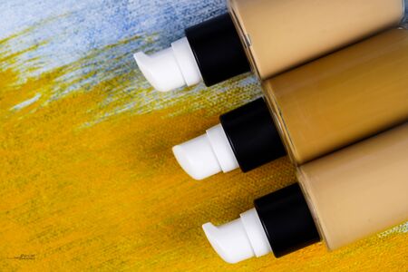 Bottle of liquid foundation on colorful background.の写真素材