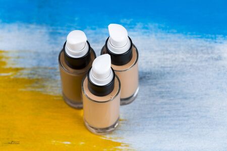 Bottle of liquid foundation on colorful background.の写真素材