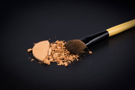 Compact powder on black background./ Compact powder.の写真素材