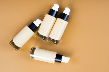 bottle of liquid foundation on brown background./ liquid foundation.の写真素材