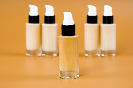 bottle of liquid foundation on brown background./ liquid foundation.の写真素材