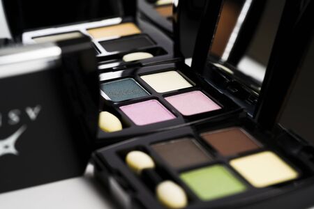 Colorful Eye shadow palette in black packing on white background.の写真素材