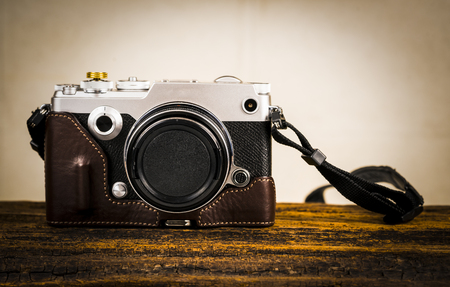Digital camera on wooden background./ Camera.の写真素材