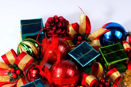 Christmas decoration  with color balls, golden pine cone, red pine cone, color gift box on white background. Christmas decoration.の写真素材