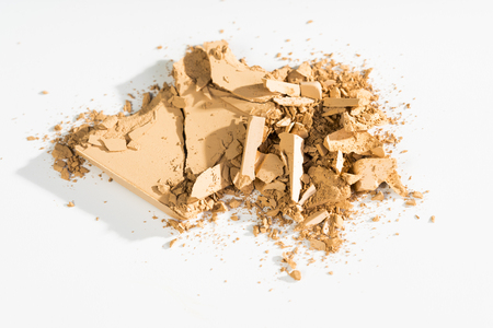 Compact broken powder on white background./ compact powderの写真素材