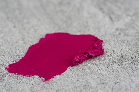 Pink lipstick and lipstick smear on stone texture background./ Lipstickの写真素材