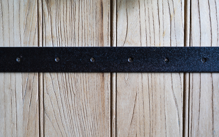 Wooden background with black steel
