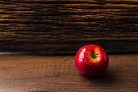 Fresh red apple on wooden backgroundの写真素材