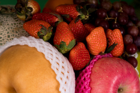 multiple fruits include apple, strawberry, grapesの写真素材