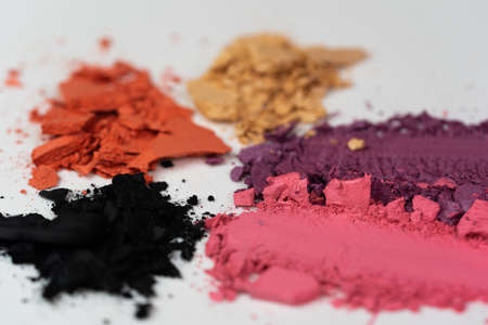 Eye shadow powder smear in pink, purple, beige, orange and black colors.の写真素材