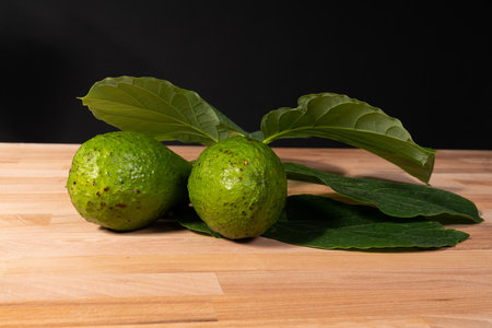 Avocado fruits on the wooden table
