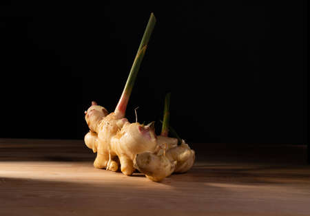 Fresh ginger on the wooden tableの写真素材