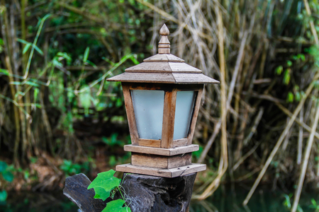 vintage wooden lamp in the gardenの写真素材