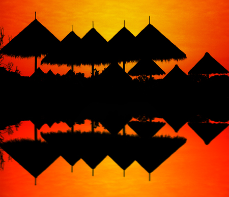 Silhouette of roof reflection in water.の写真素材