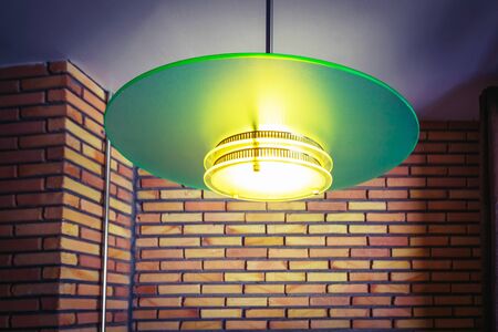 Modern green lamp and brick wallの写真素材