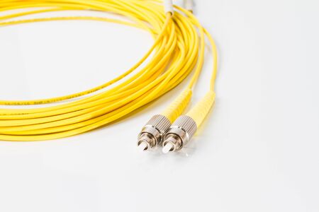 Close up of a fiber optic patchcord on white background