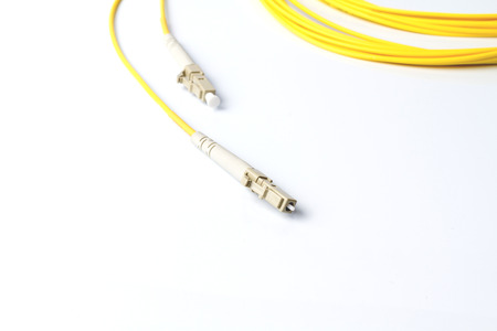 Close up of a fiber optic patchcord on white background