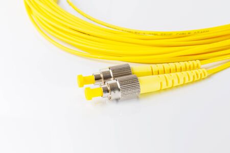 Close up of a fiber optic patchcord on white background
