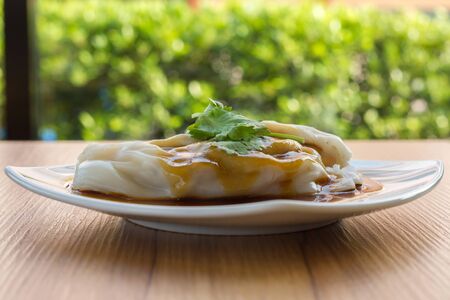 spring rolls with sweet sauce, vegetables and in noodle tubeの写真素材