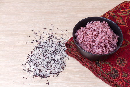 cooked jasmine rice mixed rice berry with rice grains on wood tableの写真素材